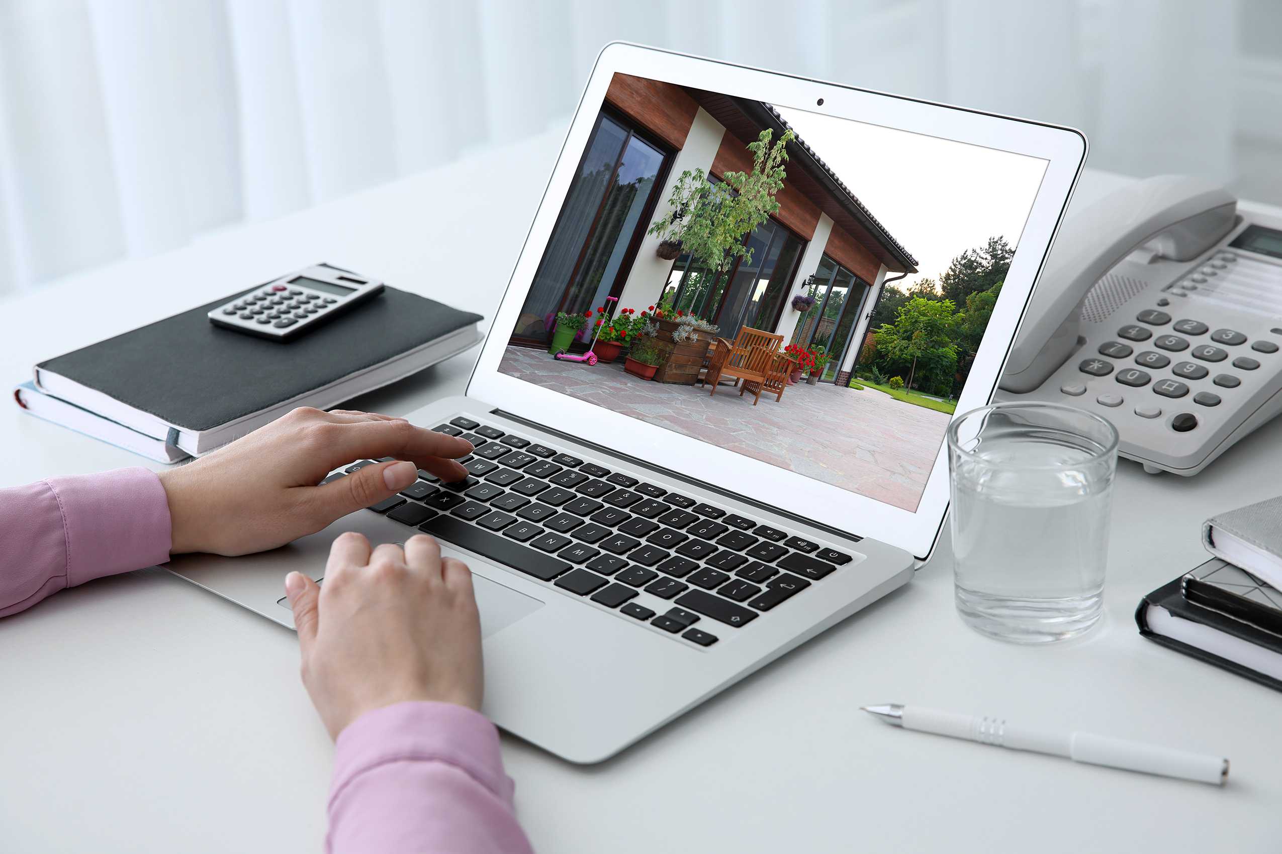 person typing on silver Macbook