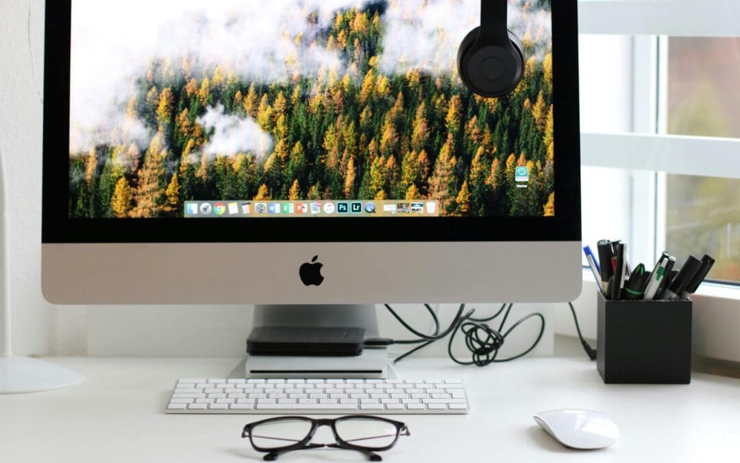 Free Stylish home office workspace featuring a computer setup with accessories. Stock Photo