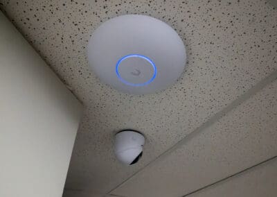 Unifi Wi-Fi access point and Unifi turret camera installed